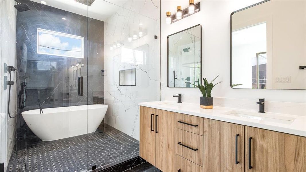 Bathroom featuring tile walls, oversized vanity, shower with separate bathtub, tile flooring, and double sink