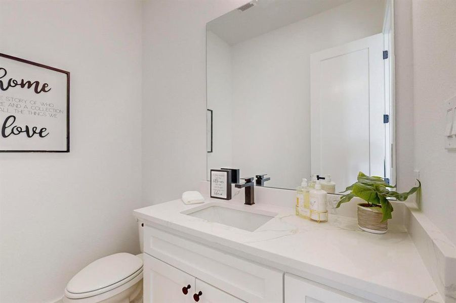 Bathroom with vanity and toilet