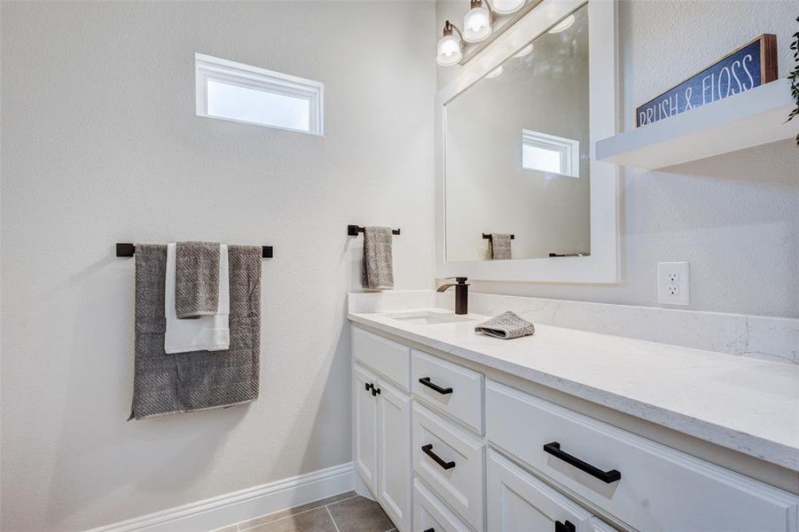 Bathroom with vanity and tile patterned floors