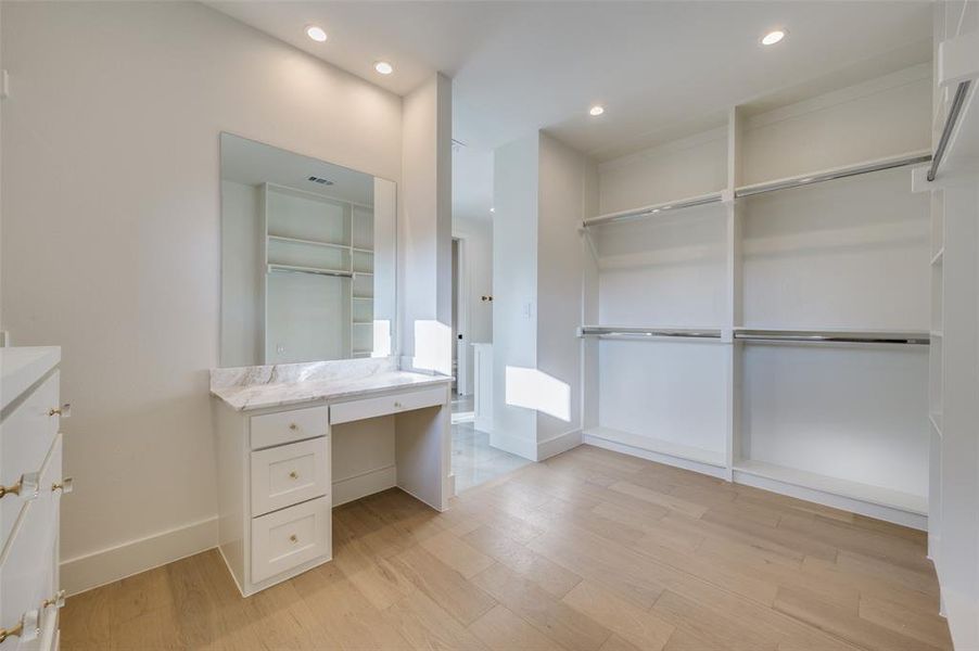 Bathroom with hardwood / wood-style flooring and vanity