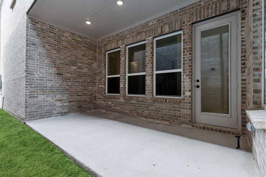 Dining al fresco is in your future on this lovely covered porch!