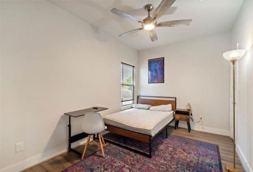 Upstairs bedroom #2 , spacious and includes a ceiling fan with LED light