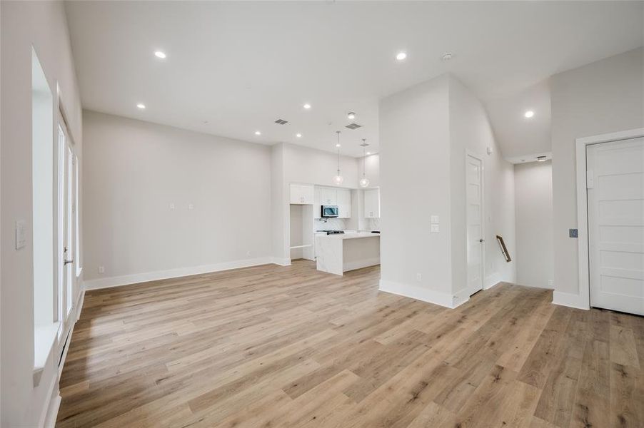 There is a powder room on the left and the  elevator door on the right allows access to all four floors.