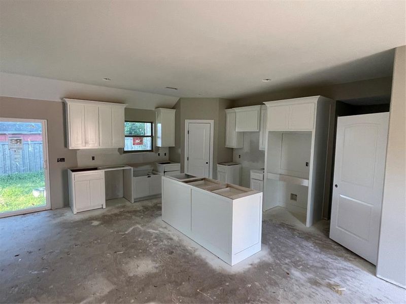 Kitchen with white cabinets and a kitchen island