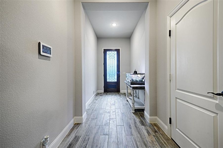 Doorway to outside featuring dark hardwood / wood-style flooring