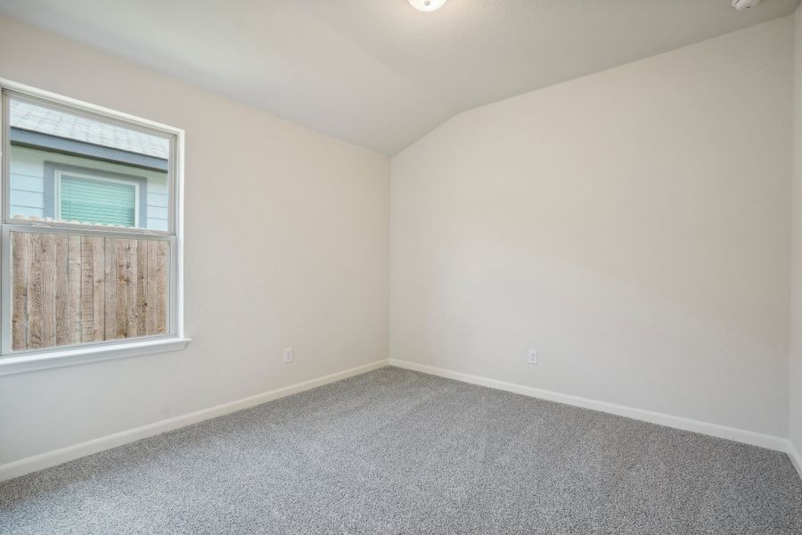 Guest bedroom in the Allen floorplan at a Meritage Homes community.