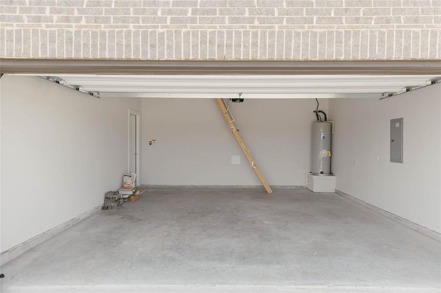 Garage with water heater and electric panel