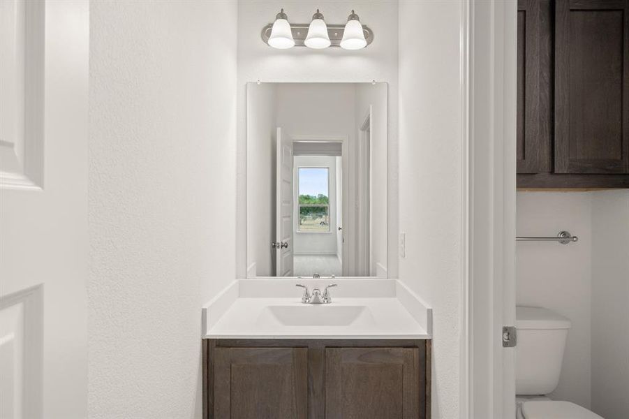 Bathroom featuring toilet and vanity