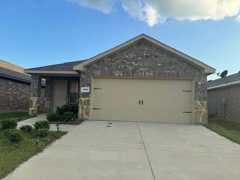 Single story home with a garage