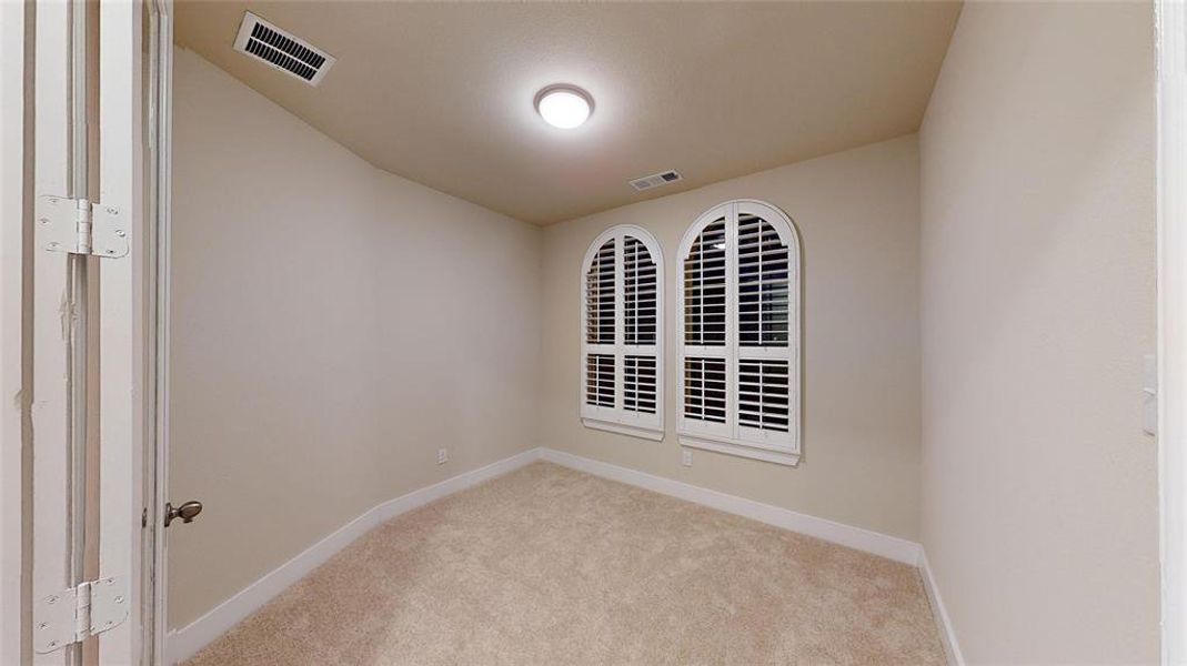 View of carpeted spare room