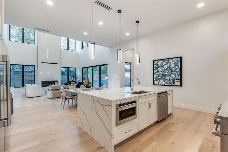 Views of Entertaining Areas and Hallway to Primary Bedroom