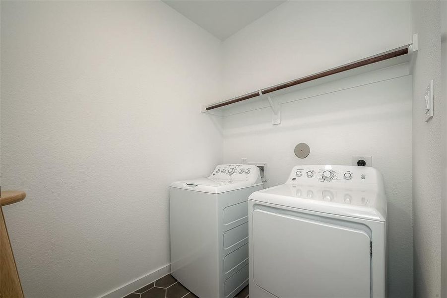 In-home utility room with storage shelf & hanging rack.