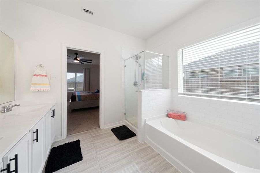 Separate shower and bathtub and more of that lovely natural light in this relaxing space.