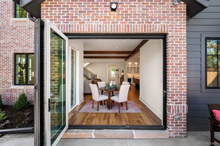 Folding glass door to connect inside living to the outdoors.