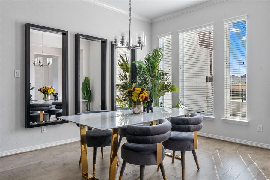 The dining room is enhanced by 3 large windows overlooking the unique courtyard.