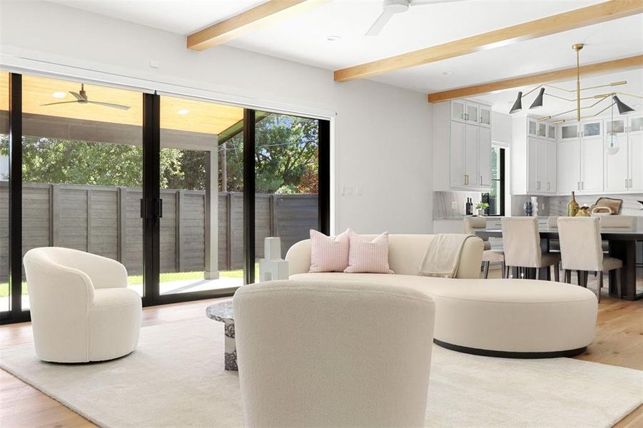 Living room with ceiling fan, beamed ceiling, and light hardwood / wood-style flooring