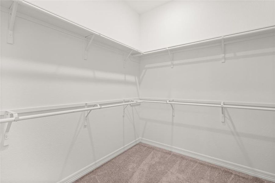 A view of your large primary walk-in closet.