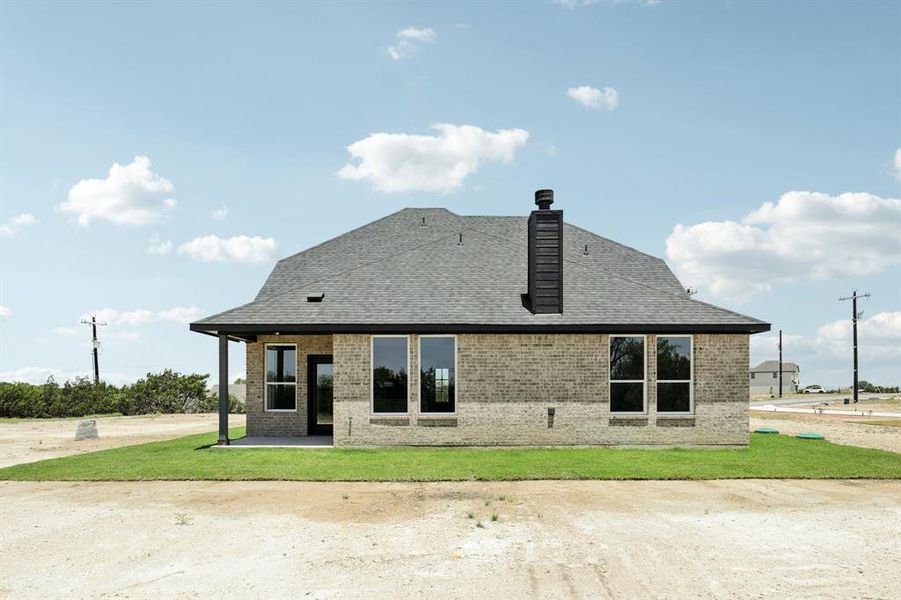 Back of property with a patio