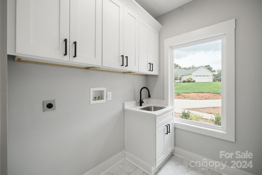 Laundry room with custom cabinets with all soft close - Utility sink