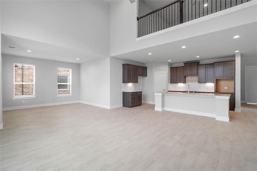 Another gorgeous view from the Family Room looking into the kitchen area and the upstairs game room.