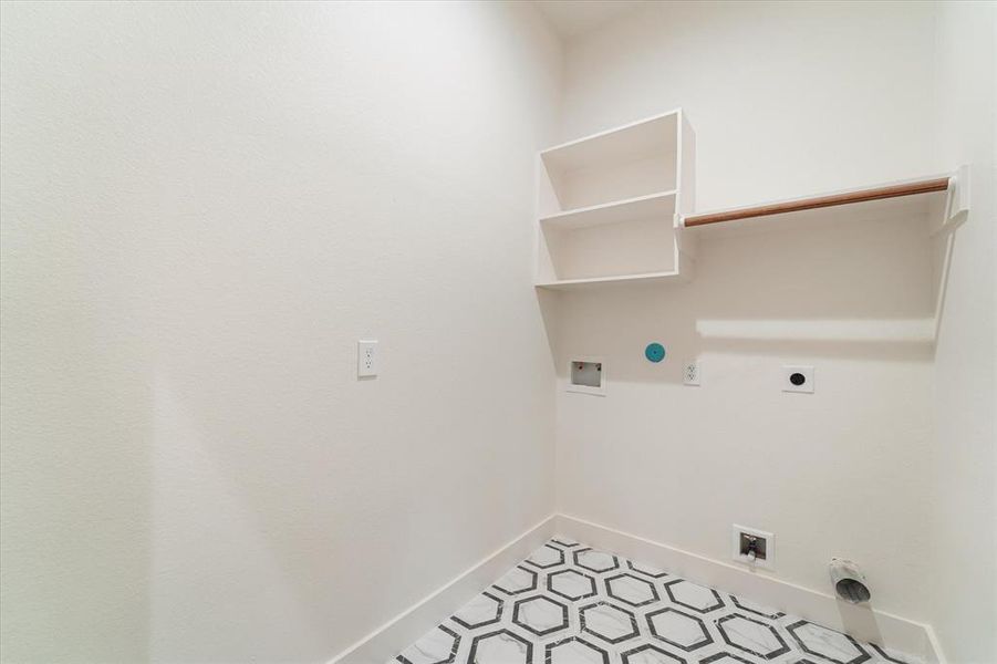 The laundry room brings the charm with cute decorative tile flooring and has hookups for both gas and electric dryers—your choice!