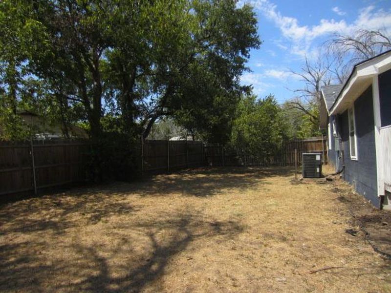 View of yard with central air condition unit