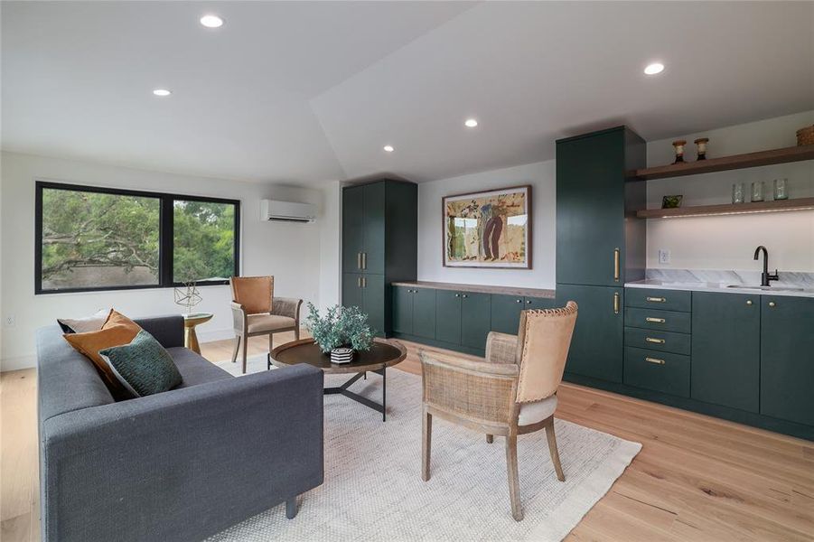 The third floor boasts magnificent neighborhood and downtown views, but the operational windows also facilitate a thermal siphon effect on cooler days, pulling hot air up the open stairs and out of the home....