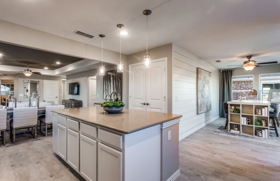 Large kitchen island overlooking gathering room an