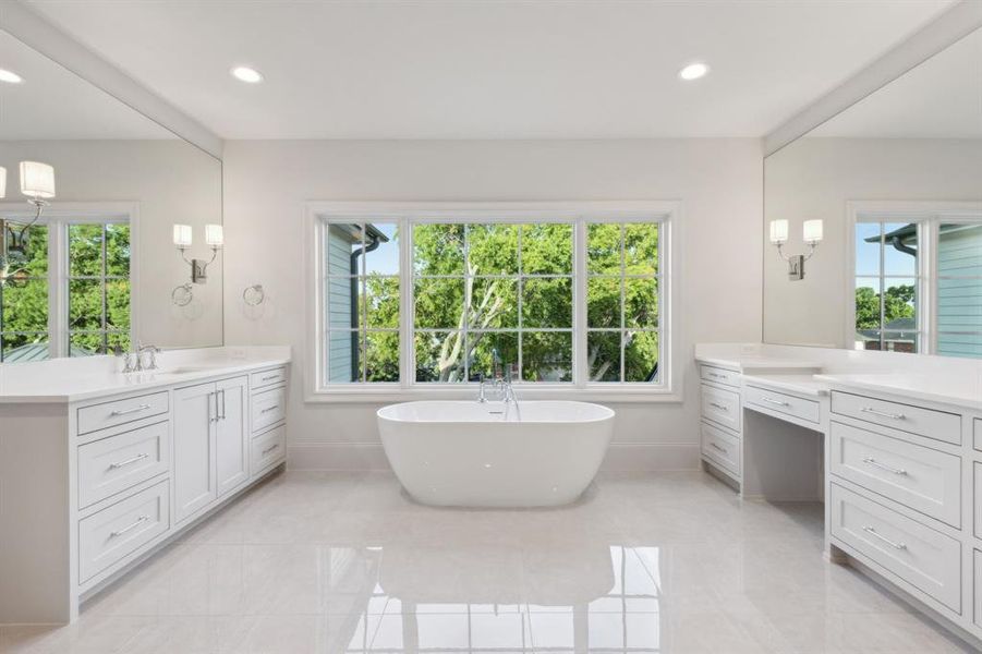 Bathroom with a wealth of natural light, a bath, and tile patterned floors