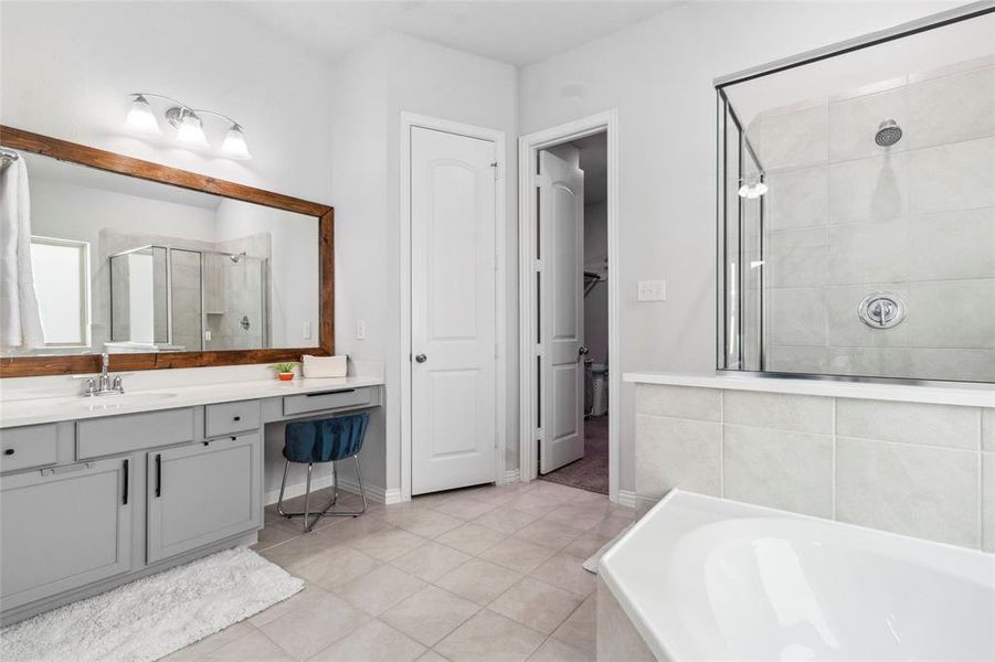 Spa-inspired master ensuite with dual vanities and modern fixtures.