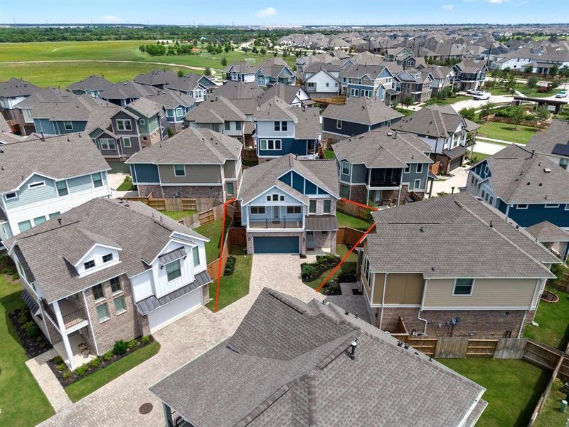 Amazing aerial shot of this gorgeous Elyson home situated on a quiet street in the sought after community of Elyson zoned to Katy ISD. Lush landscaping, well manicured front lawn and a wonderful back patio perfect to set up an outdoor seating area!