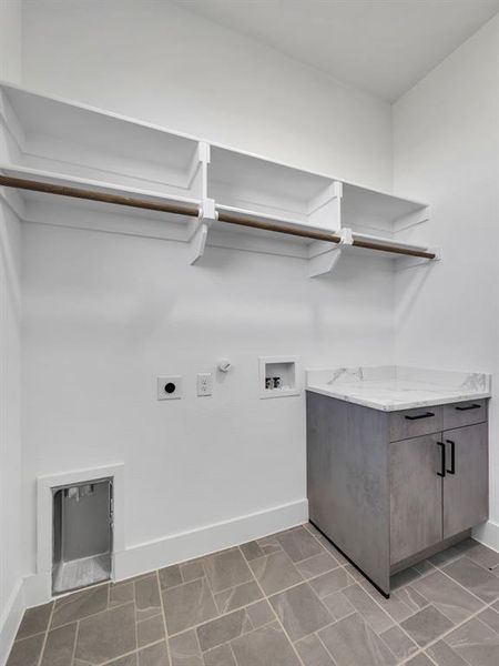 Laundry area featuring hookup for a gas dryer, washer hookup, and electric dryer hookup