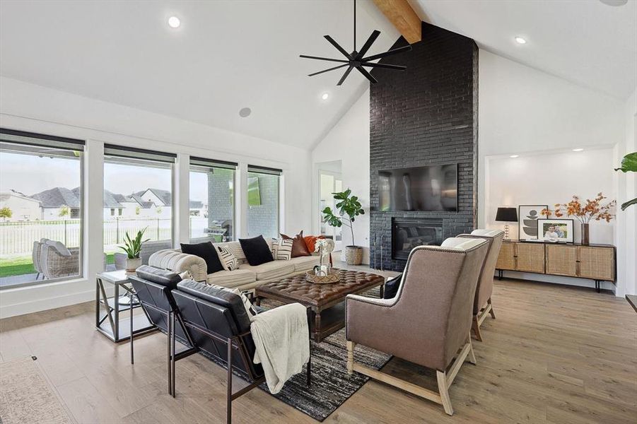 Floor to ceiling windows with custom fireplace!