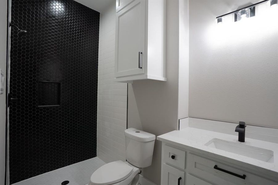 Downstairs bathroom with stunning tile selections.