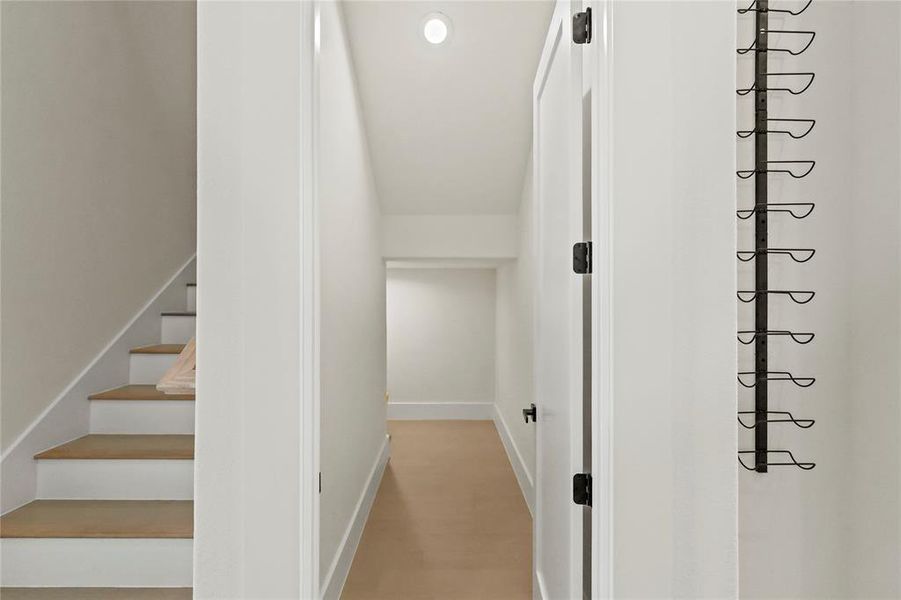 Hallway with light wood-type flooring