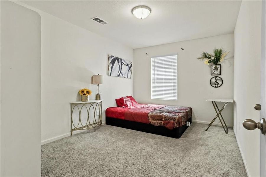 Bedroom featuring carpet