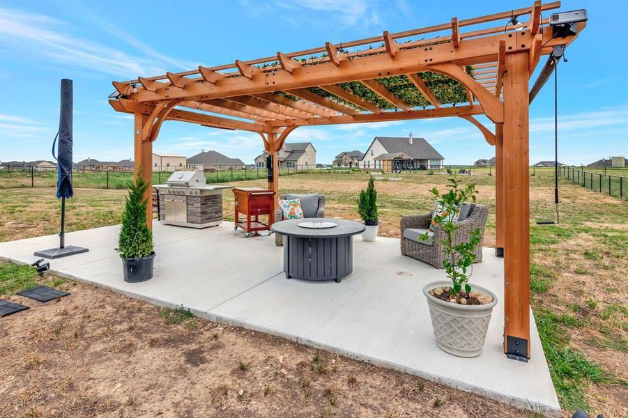 Up close view of the patio area with a pergola