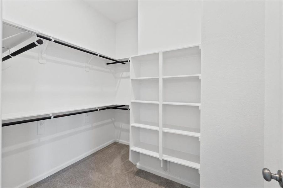 The walk-in closet features ample storage space, perfect for organizing clothes and accessories.