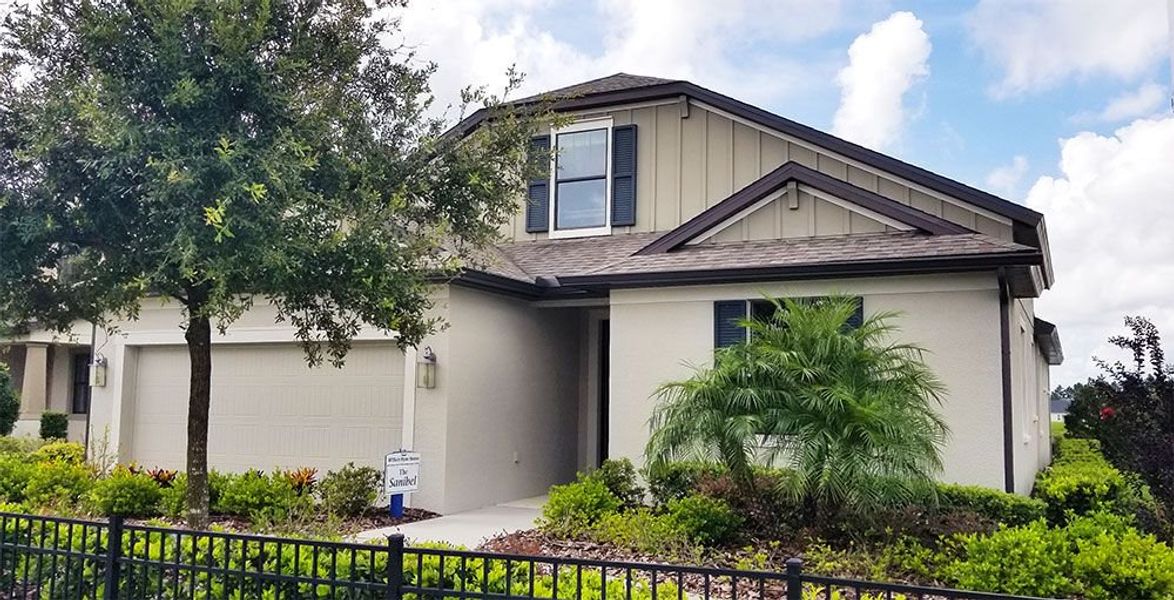 Sanibel model home front exterior craftsman elevation w/opt bonus room William Ryan Homes Tampa