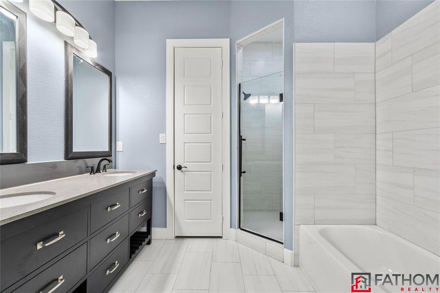 Bathroom with separate shower and tub and vanity