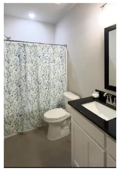 Bathroom with vanity and toilet