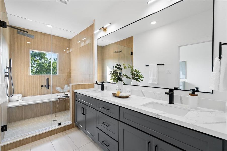 Stunning ensuite primary bathroom with enclosed walk-in shower/ tub combo.