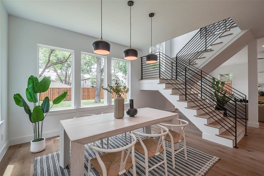 Dining room with plenty of natural light and wood-type flooring