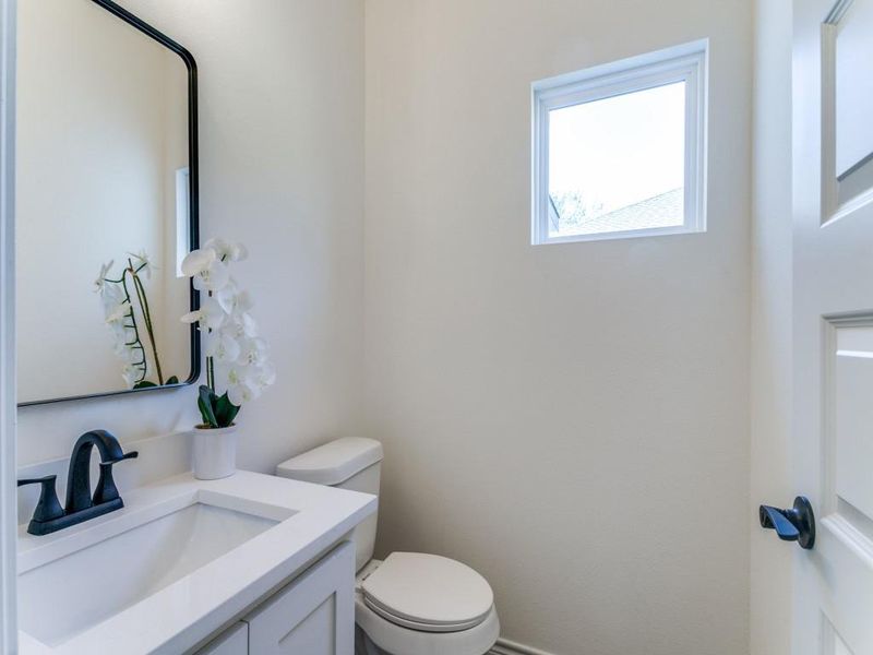 Bathroom featuring vanity and toilet