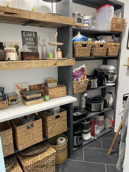 Plenty of room for storage and small appliances in walk-in pantry