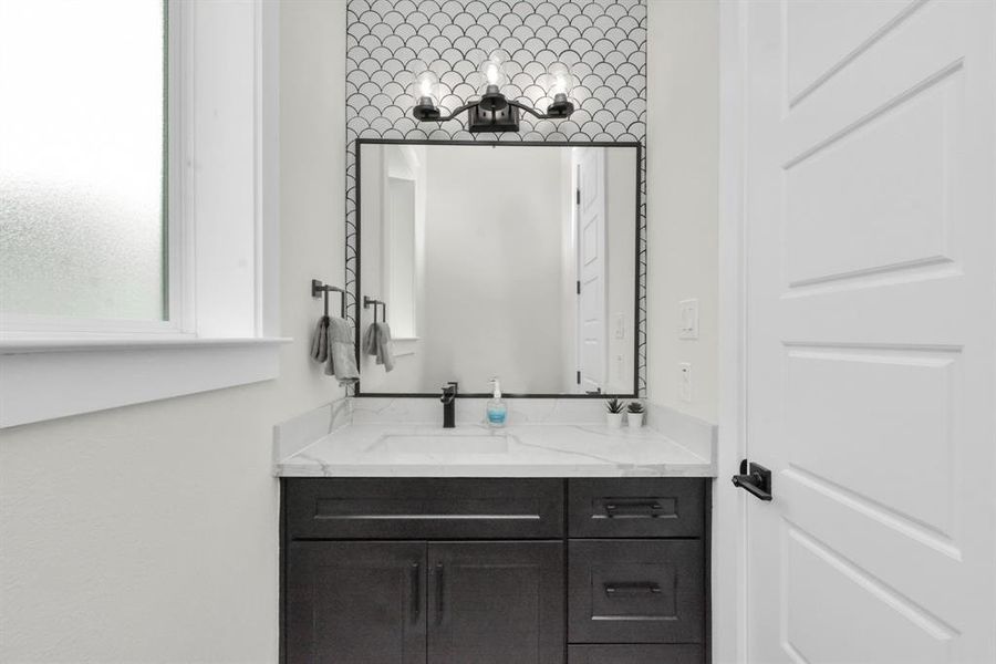 Guest half bath: Elegant powder room, modern convenience, sophisticated design, charming ambiance.