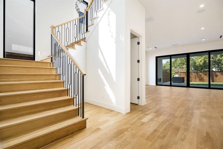 Stairway featuring hardwood / wood-style floors