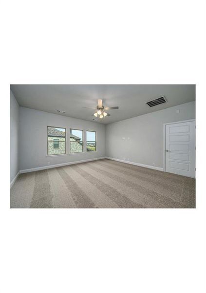 Unfurnished room with carpet flooring and ceiling fan