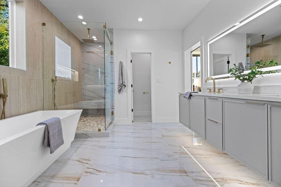 Bathroom featuring vanity and plus walk in shower