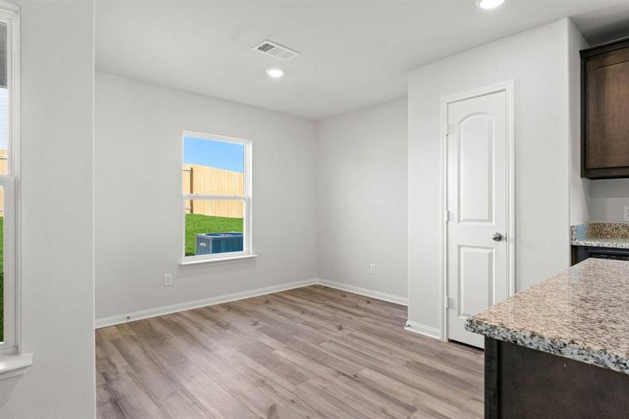 Dining space featuring light wood-type flooring